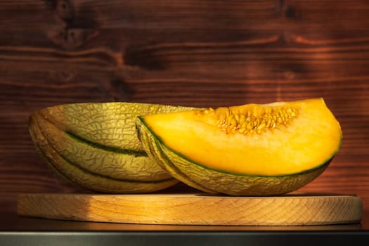 Piece of melon, close up of a table. How to peel and seed melon, close up process