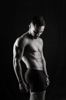 Beautiful male torso, muscular bodybuilder posing. Seductive portrait of a sport man.
