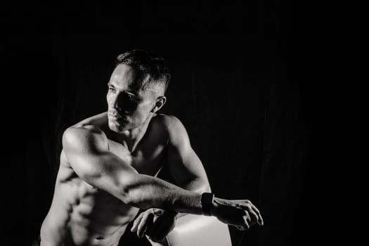 Beautiful male torso, muscular bodybuilder posing. Seductive portrait of a sport man.