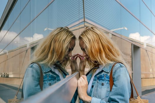 A girl with a thoughtful face who wants to show off herself in a store window. High quality photo