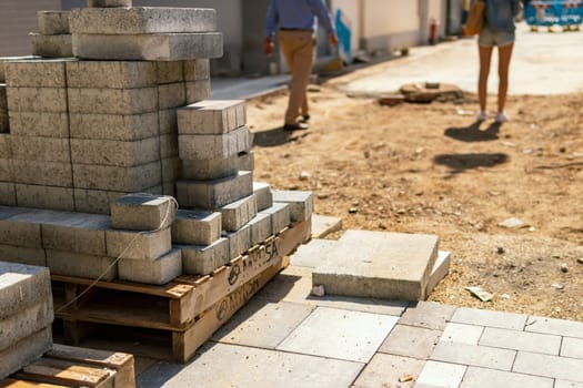 a lot of paving slabs on the street, the concept of a large construction site in the city, paving slabs on a square in the city. High quality photo