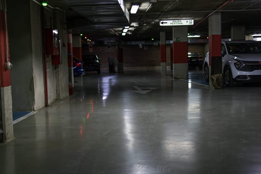 Parking in a residential building. Covered underground parking for cars.there is a place for an inscription High quality photo