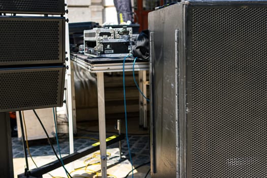 Preparation of a public event in the walled city with large speakers and sound equipment. High quality photo