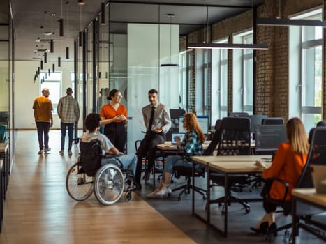 A diverse group of young business individuals congregates in a modern startup coworking center, embodying collaborative innovation and a dynamic atmosphere.