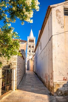 Town of Rab narrow stone street and church tower view, island of Rab, archipelago of Croatia