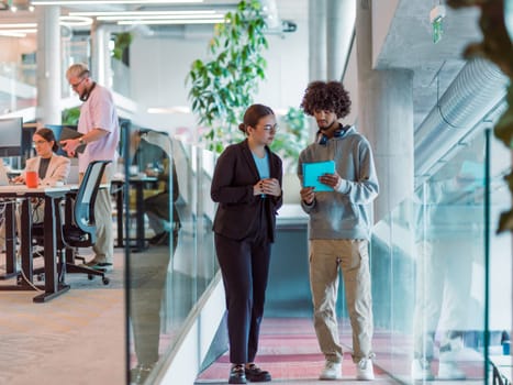 In a modern startup office, a diverse group of young professionals collaboratively tackles various business problems and challenges, surrounded by their engaged colleagues, fostering innovation and productivity.