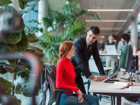 In a modern startup office, a diverse group of young professionals collaboratively tackles various business problems and challenges, surrounded by their engaged colleagues, fostering innovation and productivity.