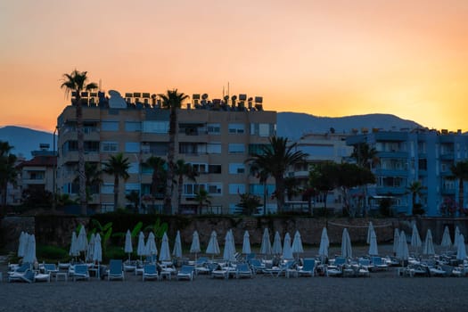 Coastline of Turkish beach in Alanya city at sunrise in early morning. Travel or vacation concept