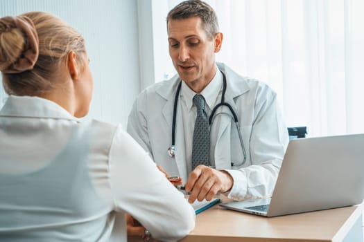 Doctor in professional uniform examining patient at hospital or medical clinic. Health care , medical and doctor staff service concept. Jivy