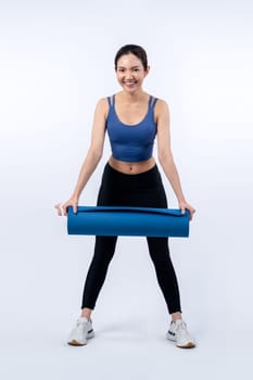 Young attractive asian woman portrait in sportswear with exercising mat. Healthy exercise and workout routine lifestyle concept. Studio shot isolated background. Vigorous