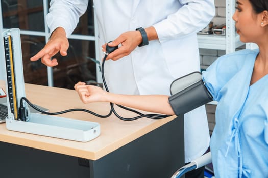 Doctor in professional uniform examining patient at hospital or medical clinic. Health care , medical and doctor staff service concept. Jivy