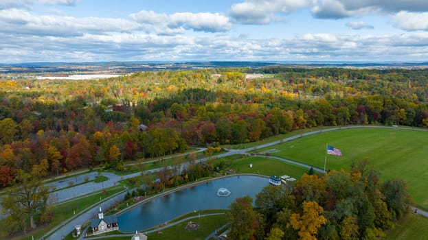 An Aerial View of Autumn Trees of Color Over Countryside, Sun and Shadows