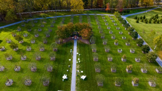 Elizabethtown, Pennsylvania, October 22, 2023 - An Aerial View of a Iron Gazebo in the Center of an Orchard on an Autumn Day