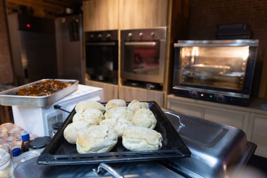 Baked bread s meticulously arranged on a wooden counter, inviting gastronomic exploration.