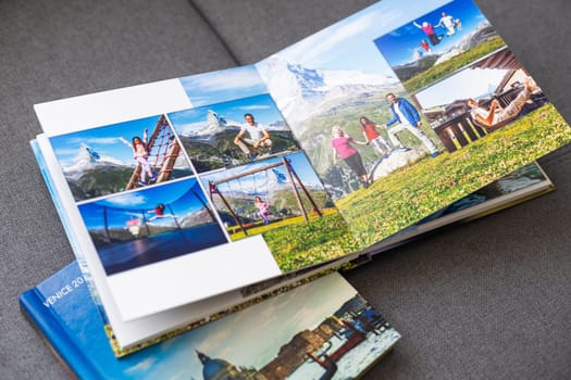 a Photobook of family at home on a background. Photobook is gift. professional photographer and designer. printing of photos and journals in photo laboratory. High quality photo