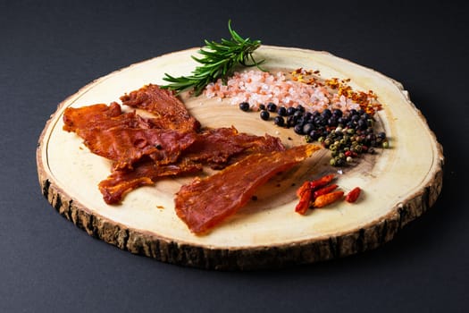 Beef jerky pieces isolated on white and black background