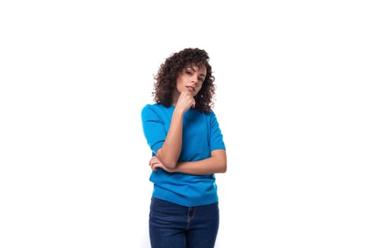 young strong woman in a blue sweater with curly hair.