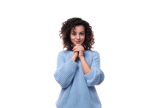 young pretty woman with curly method hairstyle smiling on background with copy space.