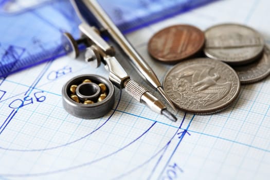 Business concept. Set of ball bearings  with coins on diagram background