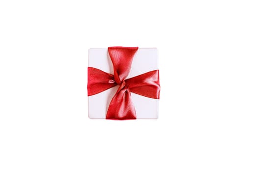 White gift box with a red bow on a white background. Top view