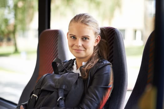 Student, portrait and transport to school on bus with a backpack and smile for education. Teenager, girl and happy journey on public transportation or travel to college, campus and university.