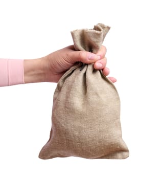 A woman's hand holds a canvas bag on a white background, the concept of a subsidy, help