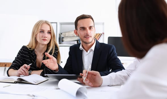 Group of people deliberate on white board problem in office closeup. Graph consult idea participate creative talk review situation job document explain council train successful decision concept