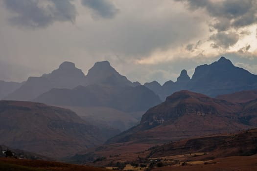 A stormy sunset at Cathedral Peak in the Drakensberg Mountains. KwaZulu-Natal Province, South Africa