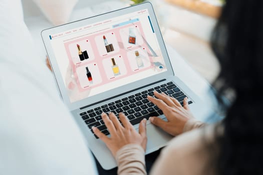 Woman shopping online on internet marketplace browsing for sale items for modern lifestyle and use credit card for online payment from wallet protected by crucial cyber security software