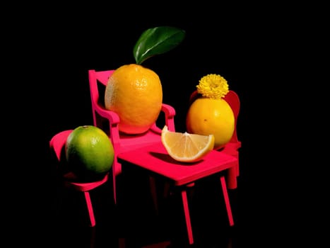 Creative still life with three lemons at the table on a black background