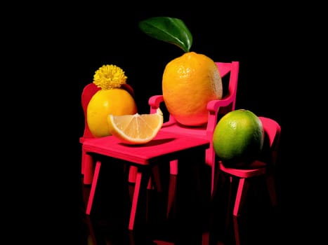 Creative still life with three lemons at the table on a black background