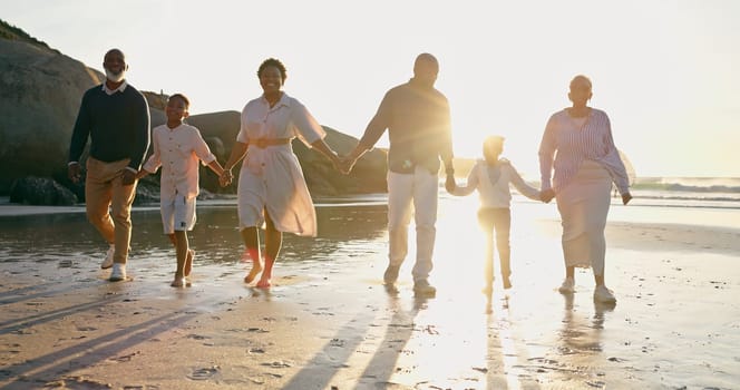 Family, fun and holding hands at beach, support and unity or trust, ocean and solidarity or care. Happy black people, sea and love or joy, bonding or water on vacation, holiday and laughing at sunset.