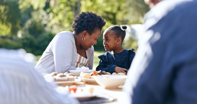 Smile, mother or daughter with lunch in garden, food or nature relax for vacation together with love. Black people, woman or child as happy family, reunion and care bonding for brunch table in park.