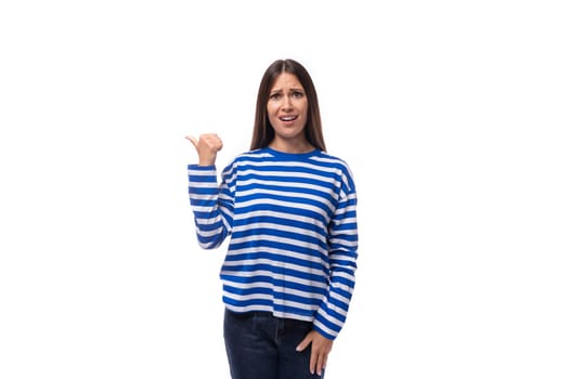 young charming brunette lady with straight hair is dressed in a blue blouse on a white background with copy space.