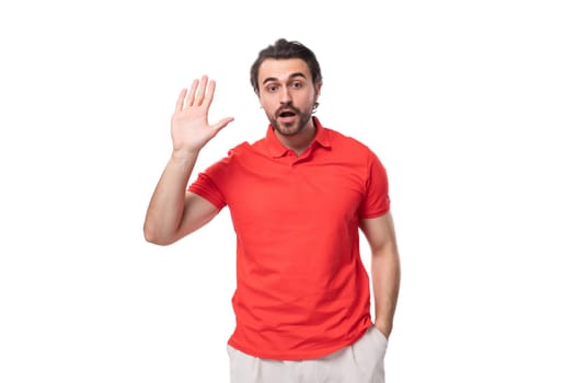 young confused man with black hair and beard dressed in a red t-shirt with an identity mockup on a white background with copy space.