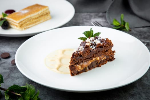 gluten-free chocolate cake with powdered sugar and mint