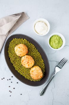 corn baursaks with kaymak sauce in a plate with cereal