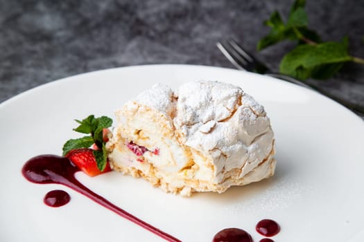 sweet sponge dessert with raspberries and powdered sugar