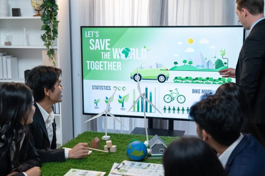 Businessman leader give presentation on eco-friendly implementation in order to reduce CO2 emission and make sustainable ecology for greener future with renewable alternative energy technology. Quaint