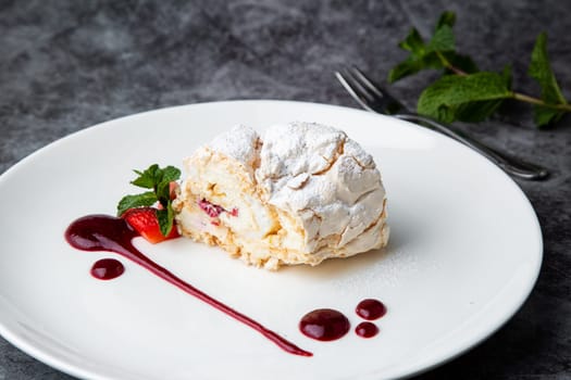 sweet sponge dessert with raspberries and powdered sugar