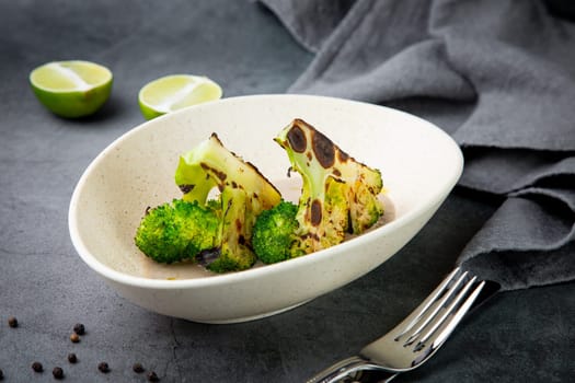 baked broccoli in mushroom sauce on a white plate