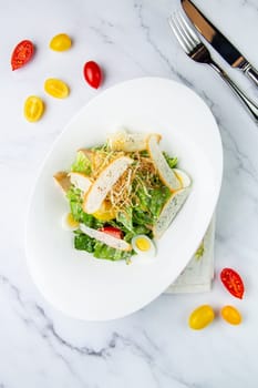 salad with quail eggs, cherry tomatoes, lettuce and breadcrumbs