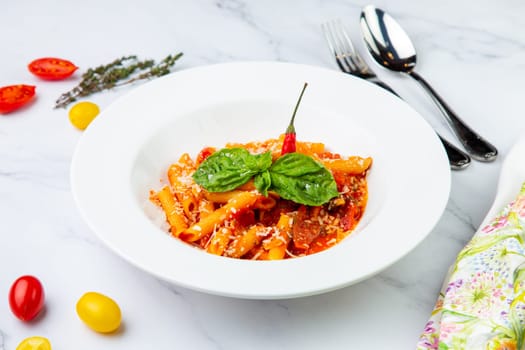 pasta in tomato sauce with cheese and herbs