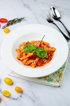 pasta in tomato sauce with cheese and herbs