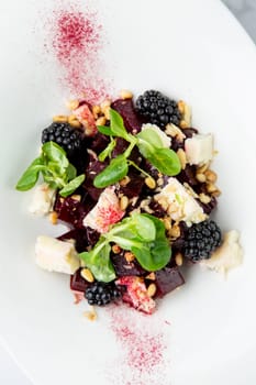 salad of blackberries, beets, seeds and cheese