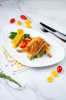 chicken thighs with corn, cherry tomatoes and herbs