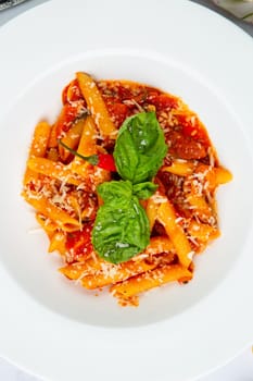 pasta in tomato sauce with cheese and herbs