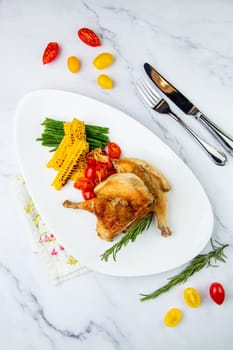 chicken thighs with corn, cherry tomatoes and herbs