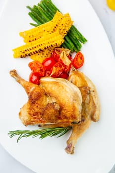 chicken thighs with corn, cherry tomatoes and herbs