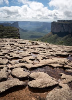 A heart-shaped rock atop Morro do Padre Ignacio cliff in Chapada Diamantina provides stunning valley views.